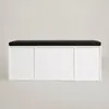 A white shoe cabinet with a black cushioned top, shown from the front against a plain light gray background. Náhľad obrázku produktu