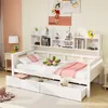 A white wooden daybed with drawers and shelves, decorated with pillows and a stuffed animal. Voir les images du produit
