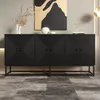 A black sideboard with a geometric pattern on its doors is displayed in a room with a gray wall and a marble-tiled floor. Decorative items like a vase with dried flowers, a white vase, and a geometric sculpture are placed on top of the sideboard. Voir les images du produit