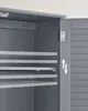 Interior view of a gray cabinet with adjustable shelves and a door hinge. Produktbild-Vorschau