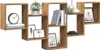 A display of decorative items and books on a wooden modular shelf unit. Produktbild-Vorschau