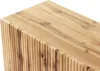 A close-up view of the top and side of a wooden cabinet with a fluted texture on the side. Náhľad obrázku produktu