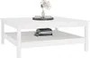 A white wooden coffee table with a shelf underneath, decorated with a vase of flowers and two cups on top. Náhľad obrázku produktu