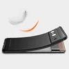 A black phone case is shown with a feather and an orange swoosh graphic, suggesting lightness and style. Náhled obrázku produktu