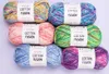 A collection of six skeins of yarn arranged in three rows of two. Produktbild-Vorschau