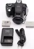 A Canon PowerShot SX50 HS digital camera and its accessories are laid out on a white background. Produktbild-Vorschau