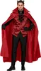 A man wearing a devil costume, including a red cape and vest, black pants, and horns. Podgląd zdjęcia produktu
