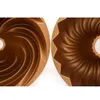 Close-up view of two different bundt cake pans. Podgląd zdjęcia produktu