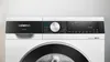Close-up of the control panel and top of a white washing machine. Produktbild-Vorschau