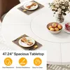 A white round dining table with place settings and a bowl of fruit. Podgląd zdjęcia produktu