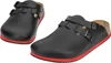 A pair of black clogs with red soles and brown insoles are shown against a white background. Náhled obrázku produktu