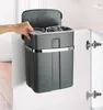 A hand is shown placing a trash can into a cabinet. Anteprima dell’immagine prodotto
