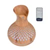 A wooden-patterned aroma diffuser with a remote control. Produktbild-Vorschau