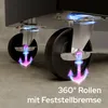 Close-up of the wheels of a black workshop trolley, highlighting their 360-degree rolling capability and locking brakes with glowing anchor icons. Náhled obrázku produktu