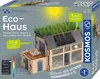 The image shows the packaging of a KOSMOS Eco Haus experiment kit, featuring a model house with a green roof and solar panels. Produktbild-Vorschau
