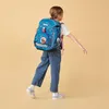 A child wearing a backpack and walking. Anteprima dell’immagine prodotto
