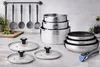 A set of stainless steel cookware arranged on a kitchen countertop. Produktbild-Vorschau
