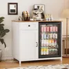 A white kitchen buffet with a built-in cooler and a coffee machine on top. Produktbild-Vorschau