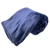A rolled-up dark blue blanket is shown against a white background. Produktbild-Vorschau