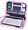 An open pink pencil case with various school supplies inside. Náhled obrázku produktu
