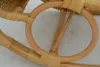 A close-up view of the rattan frame of a rocking chair. Produktbild-Vorschau