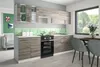 A modern kitchen with light gray cabinets and a white countertop, featuring a stovetop and oven. Náhľad obrázku produktu