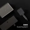 A dark, moody shot of a shower system with multiple components laid out on a black surface. Produktbild-Vorschau