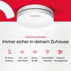 A white smoke detector is shown mounted on a white surface with a red background element. Produktbild-Vorschau