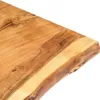 A close-up view of the edge of a wooden tabletop with a live edge. Náhled obrázku produktu