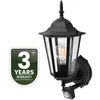 A black outdoor wall lantern with a motion sensor and a glass enclosure, shown on a white background. A green badge with '3 YEARS WARRANTY' is on the left. Náhľad obrázku produktu