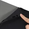 A close-up shot of a hand touching the edge of a black tablet case. Náhľad obrázku produktu