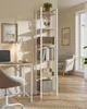 A home office setup with a desk, chair, and a tall bookshelf. Produktbild-Vorschau