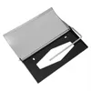 A paper towel dispenser with a metal top and black plastic base. Produktbild-Vorschau