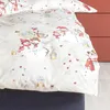 A close-up of a duvet cover with a winter-themed print of snowmen. Produktbild-Vorschau