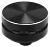 A close-up, studio shot of a small, black, round Bluetooth speaker. Náhľad obrázku produktu