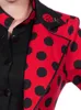 A close-up of a woman wearing a red and black polka dot jacket with a ladybug brooch. Produktbild-Vorschau