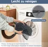 A person is putting a grey dog bed cover into a washing machine. A close-up of a zipper is shown in a circle. Voir les images du produit