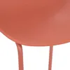 Close-up of a coral-colored chair seat and legs. Produktbild-Vorschau