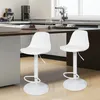 Two white bar stools are shown in a modern kitchen setting. Produktbild-Vorschau