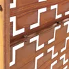 A close-up view of a Corten steel privacy screen with a geometric cut-out pattern. Náhled obrázku produktu