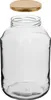 A clear glass jar with a gold lid hovering above its opening, isolated on a white background. Podgląd zdjęcia produktu