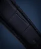 A close-up of a black leather watch strap with visible stitching and texture. Voir les images du produit
