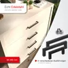 A close-up view of cabinet drawers with handles, showcasing different styles of handles and screws. Produktbild-Vorschau