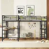 A loft bed with a desk and chair in a child's room. Voir les images du produit