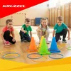 Children playing a ring toss game in a gymnasium. Produktbild-Vorschau