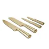 A set of four gold-colored knives arranged diagonally on a white background. Anteprima dell’immagine prodotto