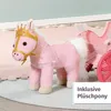 A pink plush pony with a golden crown and harness is attached to a pink carriage, shown on a rug. Produktbild-Vorschau