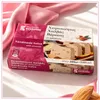 Kandylas Halva mit Mandeln 200 g Verpackung auf rosa Stoff Produktbild-Vorschau