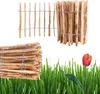 A product image featuring wooden fencing elements and a tulip in grass. Produktbild-Vorschau