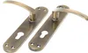 Two door handles with escutcheons on a white background. Podgląd zdjęcia produktu